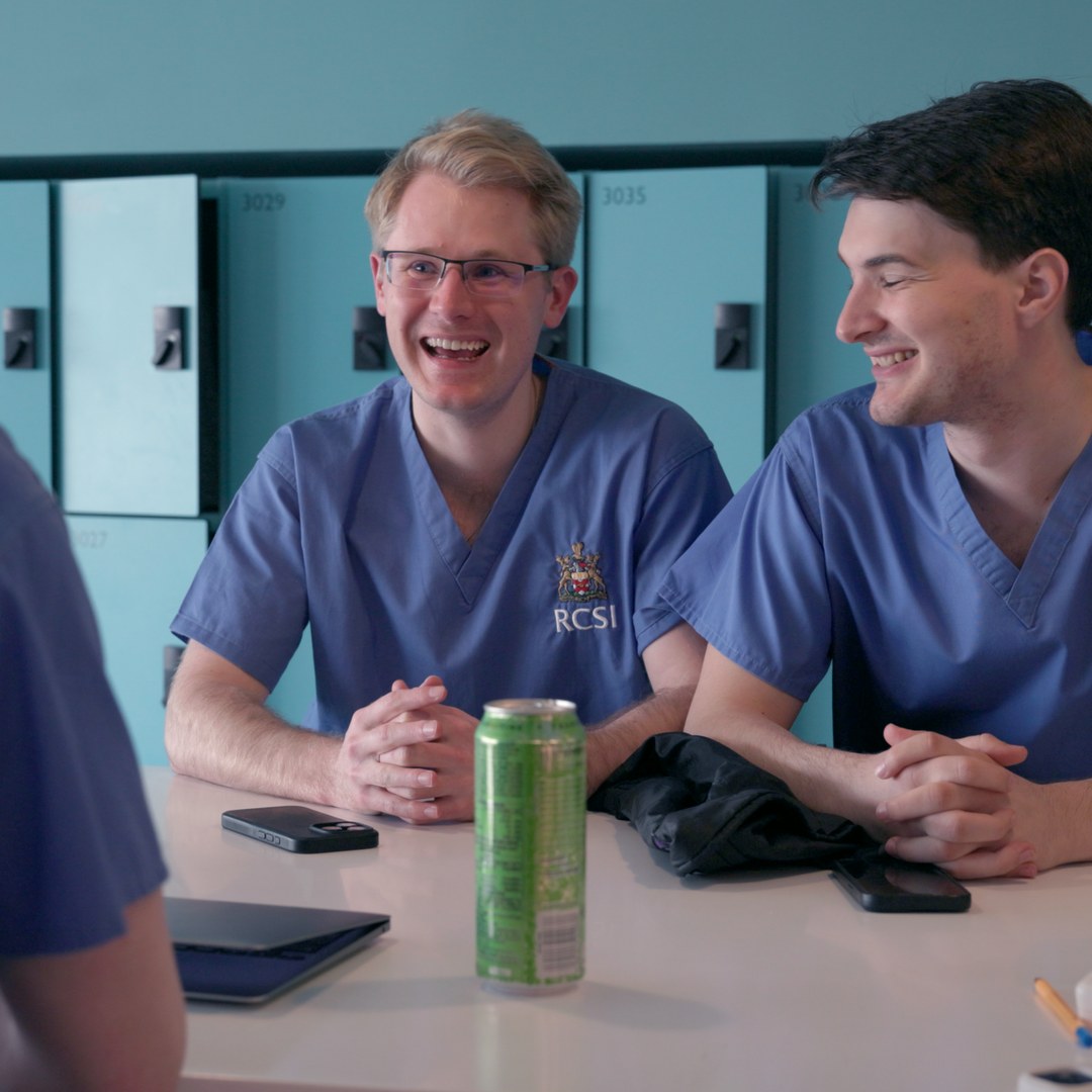 Two students in RCSI scrubs, for the education and architecture film.
