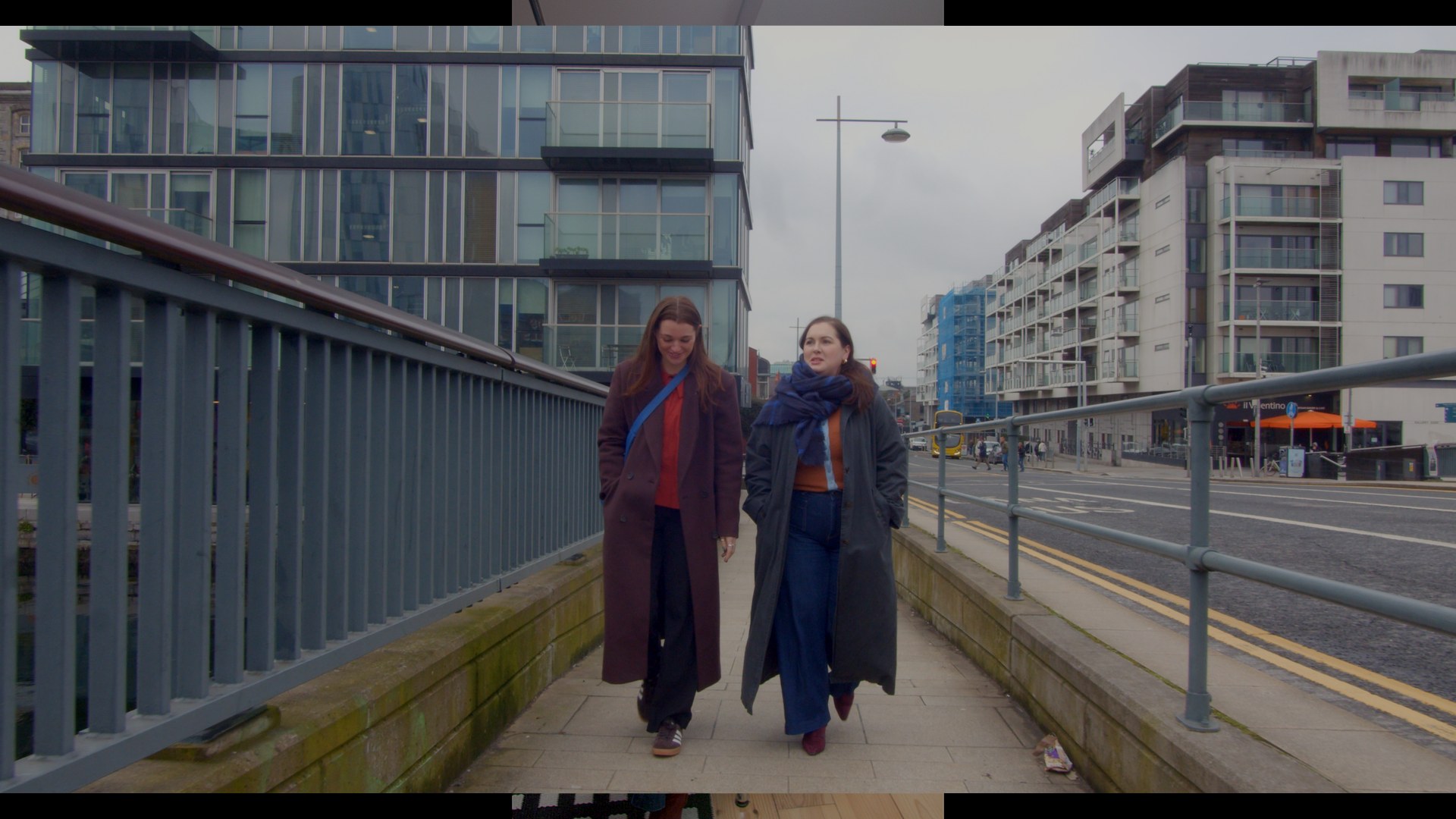 Walking the quays, the city behind.