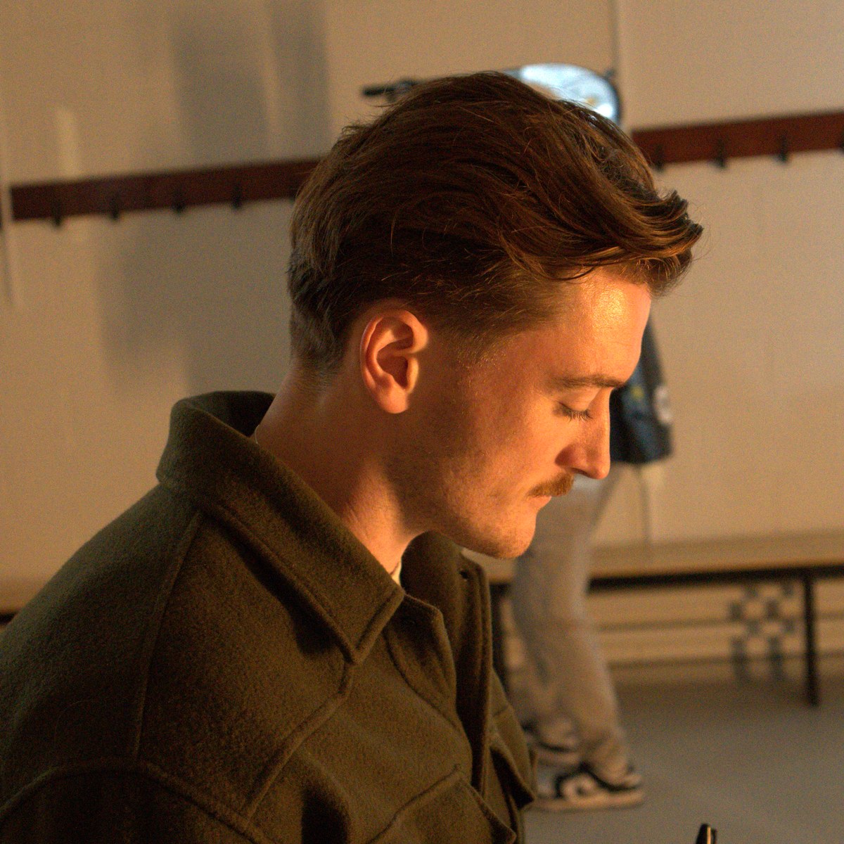Oisín on the phone between setups, keeping the day moving.