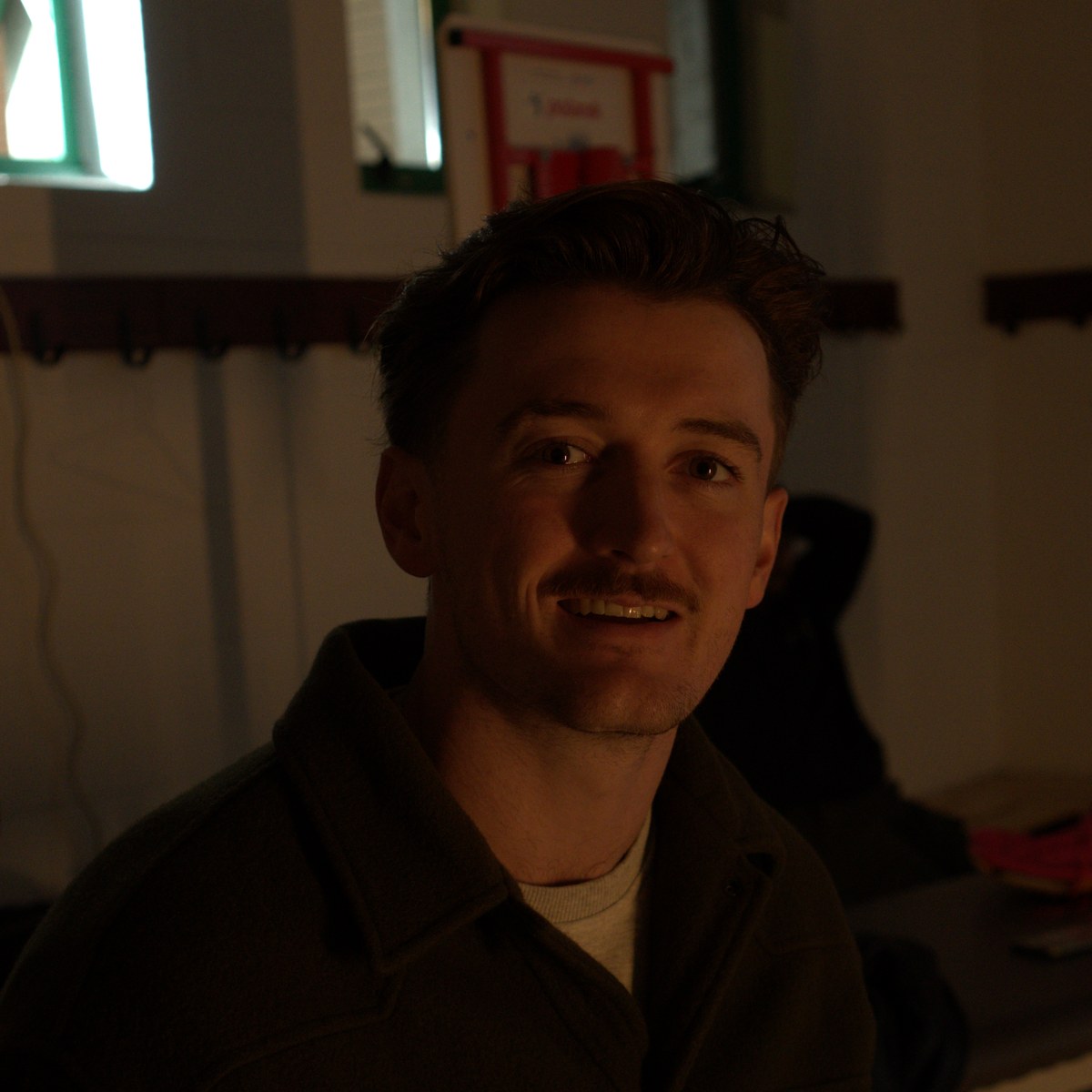 Oisín laughing with the crew mid-shoot.