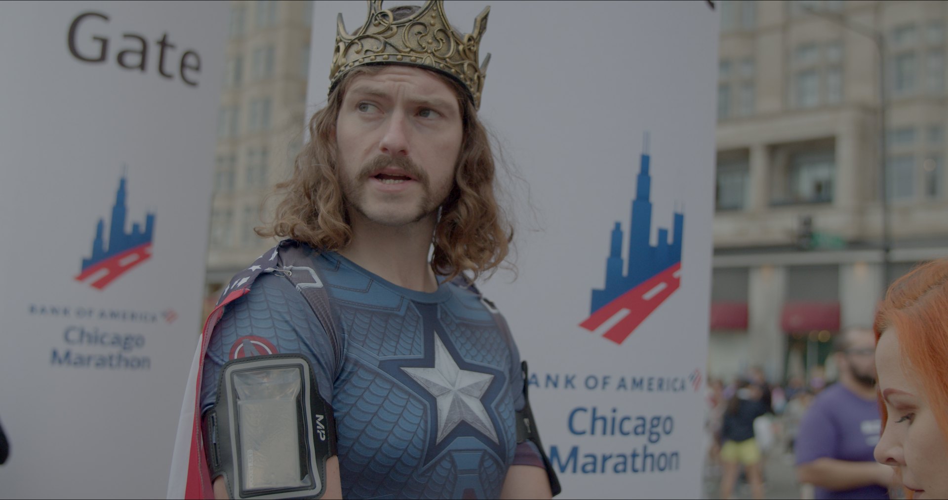 Iain in the crown and a Captain America shirt at the Chicago Marathon gate.