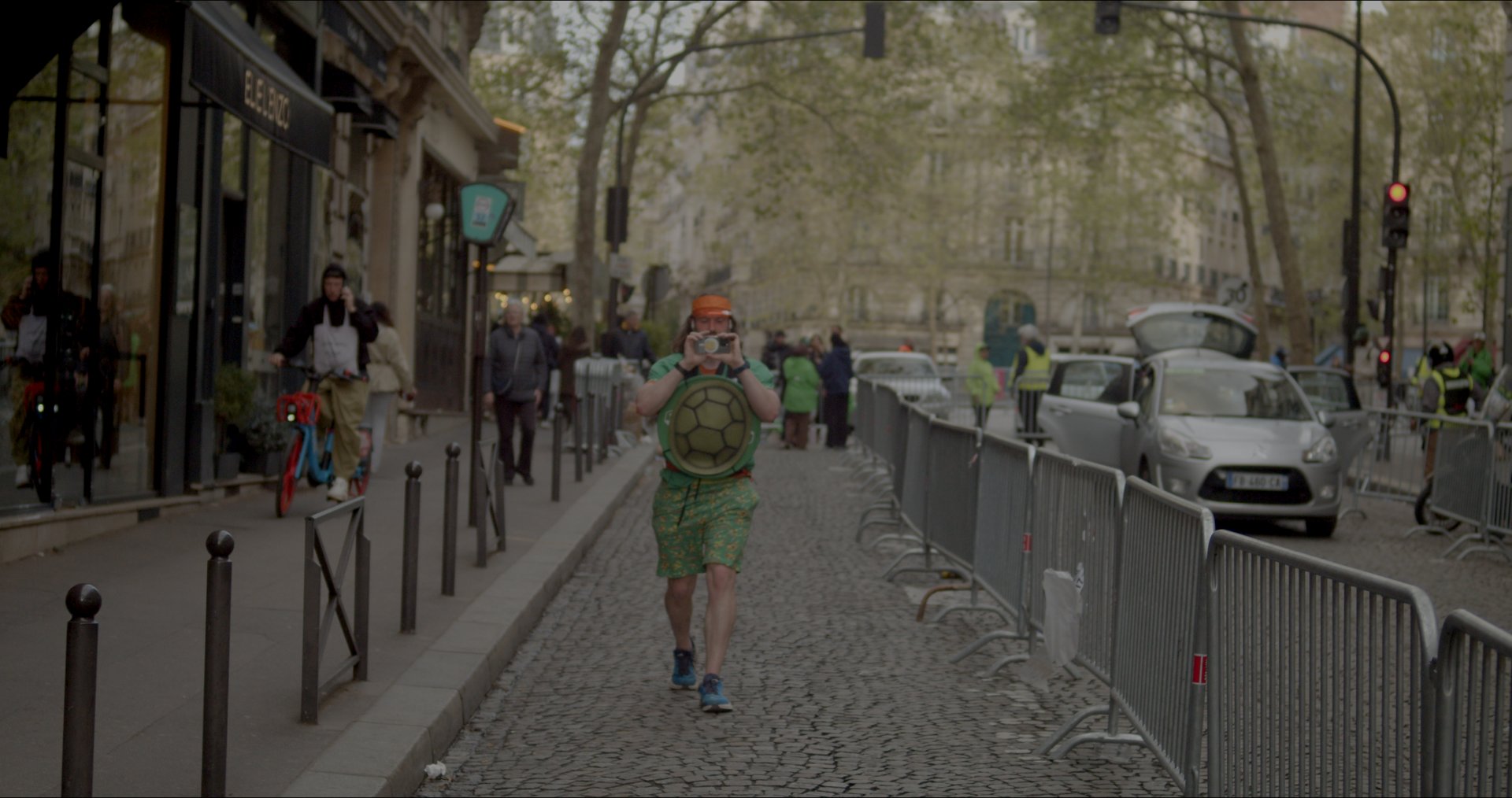 Walking the cobbled Paris course between crowd barriers.