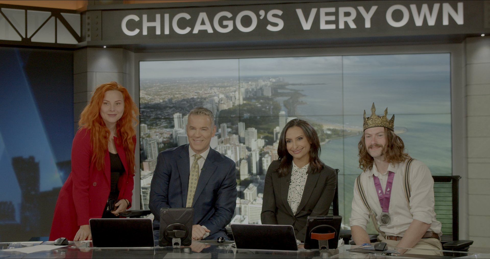 On a Chicago television panel in the crown, under the CHICAGO'S VERY OWN sign.