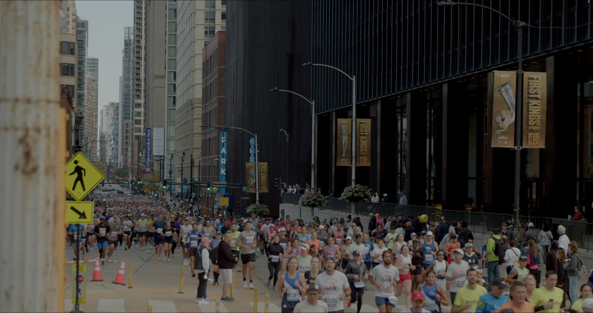 The Chicago Marathon field filling a street between the skyscrapers.